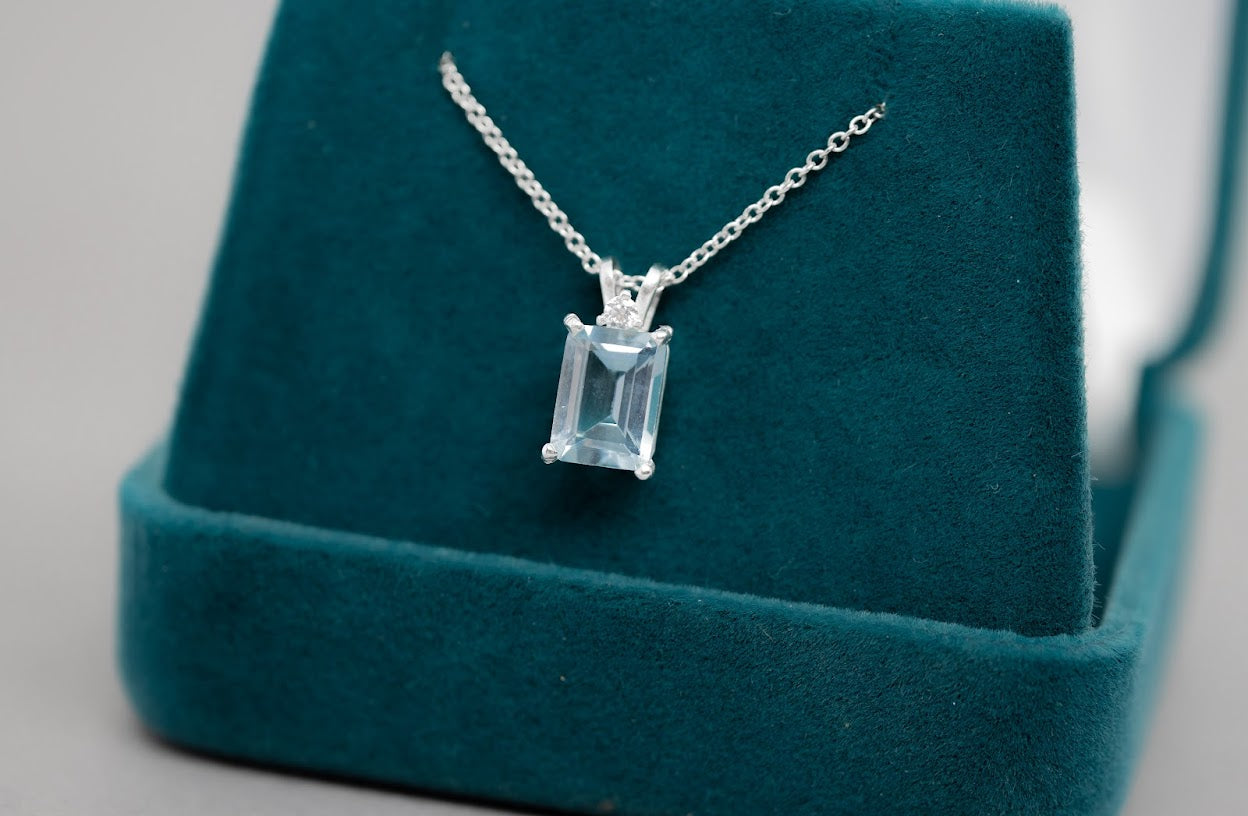 Unforgettable 8x6mm Emerald cut topaz pendant